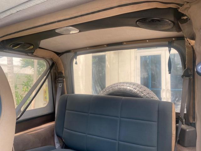 1999 Forest Green Pearl /Camel/Dark Green Jeep Wrangler Sahara AUYO AC 6 CYL LOW MILES 47,009 (1J4FY49S0XP) with an 4.0L SMPI I6 Power Tech Engine engine, Automatic transmission, located at 4701 North Dixie Hwy, Pompano Beach, FL, 33064, (954) 422-2889, 26.240938, -80.123474 - OUR WEBPAGE FLORIDACARS1.COM HAS OVER 100 PHOTOS AND FREE CARFAX LINK 1999 Jeep Wrangler Sahara Utility (Blazer, Jimmy, Scout, etc.) 4.0L I6 F Gasoline 20 MPG Rear Wheel Drive w/ 4X4 Features 4WD/AWD ABS Brakes Air Conditioning Alloy Wheels AM/FM Stereo Automatic Transmission Cassette Player CD Audi - Photo#77