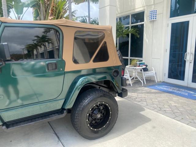 1999 Forest Green Pearl /Camel/Dark Green Jeep Wrangler Sahara AUYO AC 6 CYL LOW MILES 47,009 (1J4FY49S0XP) with an 4.0L SMPI I6 Power Tech Engine engine, Automatic transmission, located at 4701 North Dixie Hwy, Pompano Beach, FL, 33064, (954) 422-2889, 26.240938, -80.123474 - OUR WEBPAGE FLORIDACARS1.COM HAS OVER 100 PHOTOS AND FREE CARFAX LINK 1999 Jeep Wrangler Sahara Utility (Blazer, Jimmy, Scout, etc.) 4.0L I6 F Gasoline 20 MPG Rear Wheel Drive w/ 4X4 Features 4WD/AWD ABS Brakes Air Conditioning Alloy Wheels AM/FM Stereo Automatic Transmission Cassette Player CD Audi - Photo#78