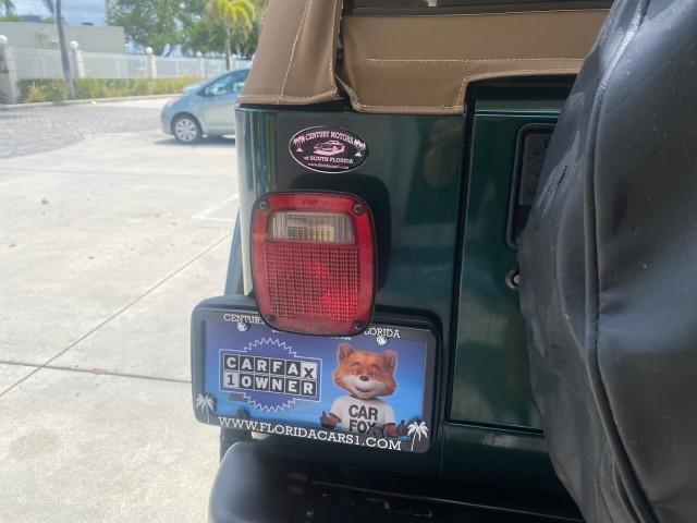 1999 Forest Green Pearl /Camel/Dark Green Jeep Wrangler Sahara AUYO AC 6 CYL LOW MILES 47,009 (1J4FY49S0XP) with an 4.0L SMPI I6 Power Tech Engine engine, Automatic transmission, located at 4701 North Dixie Hwy, Pompano Beach, FL, 33064, (954) 422-2889, 26.240938, -80.123474 - OUR WEBPAGE FLORIDACARS1.COM HAS OVER 100 PHOTOS AND FREE CARFAX LINK 1999 Jeep Wrangler Sahara Utility (Blazer, Jimmy, Scout, etc.) 4.0L I6 F Gasoline 20 MPG Rear Wheel Drive w/ 4X4 Features 4WD/AWD ABS Brakes Air Conditioning Alloy Wheels AM/FM Stereo Automatic Transmission Cassette Player CD Audi - Photo#84