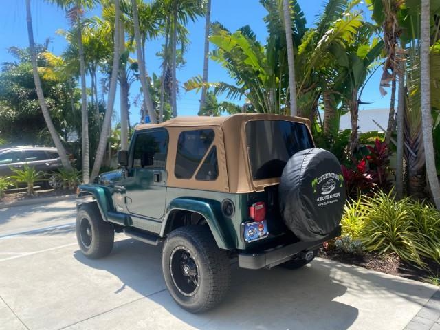1999 Forest Green Pearl /Camel/Dark Green Jeep Wrangler Sahara AUYO AC 6 CYL LOW MILES 47,009 (1J4FY49S0XP) with an 4.0L SMPI I6 Power Tech Engine engine, Automatic transmission, located at 4701 North Dixie Hwy, Pompano Beach, FL, 33064, (954) 422-2889, 26.240938, -80.123474 - OUR WEBPAGE FLORIDACARS1.COM HAS OVER 100 PHOTOS AND FREE CARFAX LINK 1999 Jeep Wrangler Sahara Utility (Blazer, Jimmy, Scout, etc.) 4.0L I6 F Gasoline 20 MPG Rear Wheel Drive w/ 4X4 Features 4WD/AWD ABS Brakes Air Conditioning Alloy Wheels AM/FM Stereo Automatic Transmission Cassette Player CD Audi - Photo#5