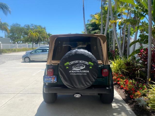 1999 Forest Green Pearl /Camel/Dark Green Jeep Wrangler Sahara AUYO AC 6 CYL LOW MILES 47,009 (1J4FY49S0XP) with an 4.0L SMPI I6 Power Tech Engine engine, Automatic transmission, located at 4701 North Dixie Hwy, Pompano Beach, FL, 33064, (954) 422-2889, 26.240938, -80.123474 - OUR WEBPAGE FLORIDACARS1.COM HAS OVER 100 PHOTOS AND FREE CARFAX LINK 1999 Jeep Wrangler Sahara Utility (Blazer, Jimmy, Scout, etc.) 4.0L I6 F Gasoline 20 MPG Rear Wheel Drive w/ 4X4 Features 4WD/AWD ABS Brakes Air Conditioning Alloy Wheels AM/FM Stereo Automatic Transmission Cassette Player CD Audi - Photo#6