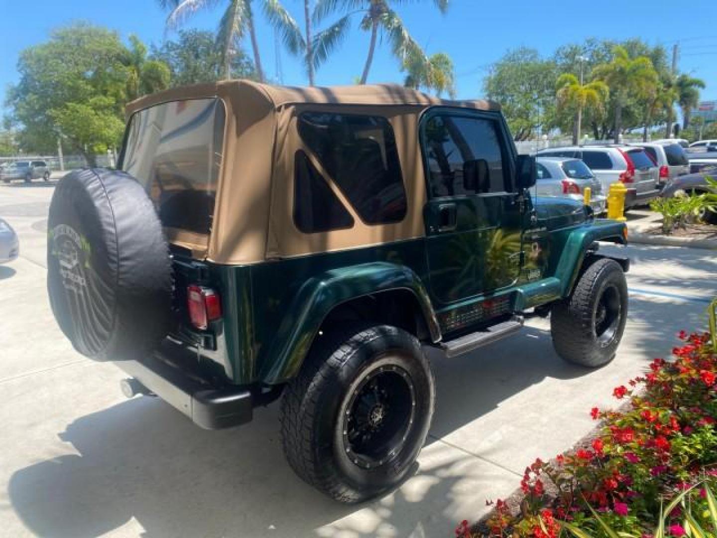 1999 Forest Green Pearl /Camel/Dark Green Jeep Wrangler Sahara AUYO AC 6 CYL LOW MILES 47,009 (1J4FY49S0XP) with an 4.0L SMPI I6 Power Tech Engine engine, Automatic transmission, located at 4701 North Dixie Hwy, Pompano Beach, FL, 33064, (954) 422-2889, 26.240938, -80.123474 - OUR WEBPAGE FLORIDACARS1.COM HAS OVER 100 PHOTOS AND FREE CARFAX LINK 1999 Jeep Wrangler Sahara Utility (Blazer, Jimmy, Scout, etc.) 4.0L I6 F Gasoline 20 MPG Rear Wheel Drive w/ 4X4 Features 4WD/AWD ABS Brakes Air Conditioning Alloy Wheels AM/FM Stereo Automatic Transmission Cassette Player CD Audi - Photo#7