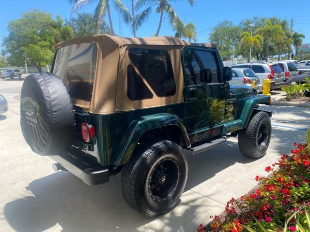 1999 Forest Green Pearl /Camel/Dark Green Jeep Wrangler Sahara AUYO AC 6 CYL LOW MILES 47,009 (1J4FY49S0XP) with an 4.0L SMPI I6 Power Tech Engine engine, Automatic transmission, located at 4701 North Dixie Hwy, Pompano Beach, FL, 33064, (954) 422-2889, 26.240938, -80.123474 - OUR WEBPAGE FLORIDACARS1.COM HAS OVER 100 PHOTOS AND FREE CARFAX LINK 1999 Jeep Wrangler Sahara Utility (Blazer, Jimmy, Scout, etc.) 4.0L I6 F Gasoline 20 MPG Rear Wheel Drive w/ 4X4 Features 4WD/AWD ABS Brakes Air Conditioning Alloy Wheels AM/FM Stereo Automatic Transmission Cassette Player CD Audi - Photo#7