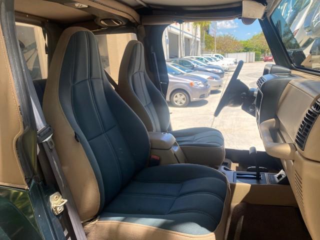 1999 Forest Green Pearl /Camel/Dark Green Jeep Wrangler Sahara AUYO AC 6 CYL LOW MILES 47,009 (1J4FY49S0XP) with an 4.0L SMPI I6 Power Tech Engine engine, Automatic transmission, located at 4701 North Dixie Hwy, Pompano Beach, FL, 33064, (954) 422-2889, 26.240938, -80.123474 - OUR WEBPAGE FLORIDACARS1.COM HAS OVER 100 PHOTOS AND FREE CARFAX LINK 1999 Jeep Wrangler Sahara Utility (Blazer, Jimmy, Scout, etc.) 4.0L I6 F Gasoline 20 MPG Rear Wheel Drive w/ 4X4 Features 4WD/AWD ABS Brakes Air Conditioning Alloy Wheels AM/FM Stereo Automatic Transmission Cassette Player CD Audi - Photo#12
