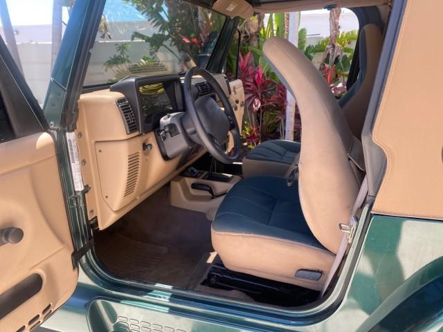 1999 Forest Green Pearl /Camel/Dark Green Jeep Wrangler Sahara AUYO AC 6 CYL LOW MILES 47,009 (1J4FY49S0XP) with an 4.0L SMPI I6 Power Tech Engine engine, Automatic transmission, located at 4701 North Dixie Hwy, Pompano Beach, FL, 33064, (954) 422-2889, 26.240938, -80.123474 - OUR WEBPAGE FLORIDACARS1.COM HAS OVER 100 PHOTOS AND FREE CARFAX LINK 1999 Jeep Wrangler Sahara Utility (Blazer, Jimmy, Scout, etc.) 4.0L I6 F Gasoline 20 MPG Rear Wheel Drive w/ 4X4 Features 4WD/AWD ABS Brakes Air Conditioning Alloy Wheels AM/FM Stereo Automatic Transmission Cassette Player CD Audi - Photo#13
