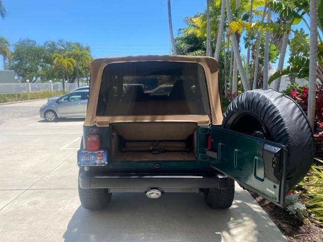 1999 Forest Green Pearl /Camel/Dark Green Jeep Wrangler Sahara AUYO AC 6 CYL LOW MILES 47,009 (1J4FY49S0XP) with an 4.0L SMPI I6 Power Tech Engine engine, Automatic transmission, located at 4701 North Dixie Hwy, Pompano Beach, FL, 33064, (954) 422-2889, 26.240938, -80.123474 - OUR WEBPAGE FLORIDACARS1.COM HAS OVER 100 PHOTOS AND FREE CARFAX LINK 1999 Jeep Wrangler Sahara Utility (Blazer, Jimmy, Scout, etc.) 4.0L I6 F Gasoline 20 MPG Rear Wheel Drive w/ 4X4 Features 4WD/AWD ABS Brakes Air Conditioning Alloy Wheels AM/FM Stereo Automatic Transmission Cassette Player CD Audi - Photo#15