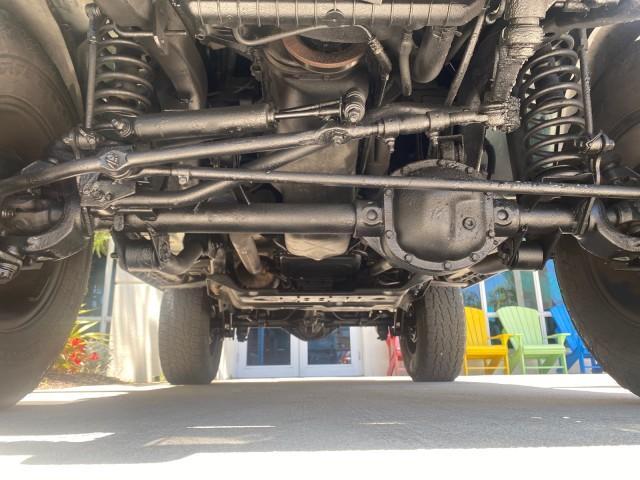 1999 Forest Green Pearl /Camel/Dark Green Jeep Wrangler Sahara AUYO AC 6 CYL LOW MILES 47,009 (1J4FY49S0XP) with an 4.0L SMPI I6 Power Tech Engine engine, Automatic transmission, located at 4701 North Dixie Hwy, Pompano Beach, FL, 33064, (954) 422-2889, 26.240938, -80.123474 - OUR WEBPAGE FLORIDACARS1.COM HAS OVER 100 PHOTOS AND FREE CARFAX LINK 1999 Jeep Wrangler Sahara Utility (Blazer, Jimmy, Scout, etc.) 4.0L I6 F Gasoline 20 MPG Rear Wheel Drive w/ 4X4 Features 4WD/AWD ABS Brakes Air Conditioning Alloy Wheels AM/FM Stereo Automatic Transmission Cassette Player CD Audi - Photo#21