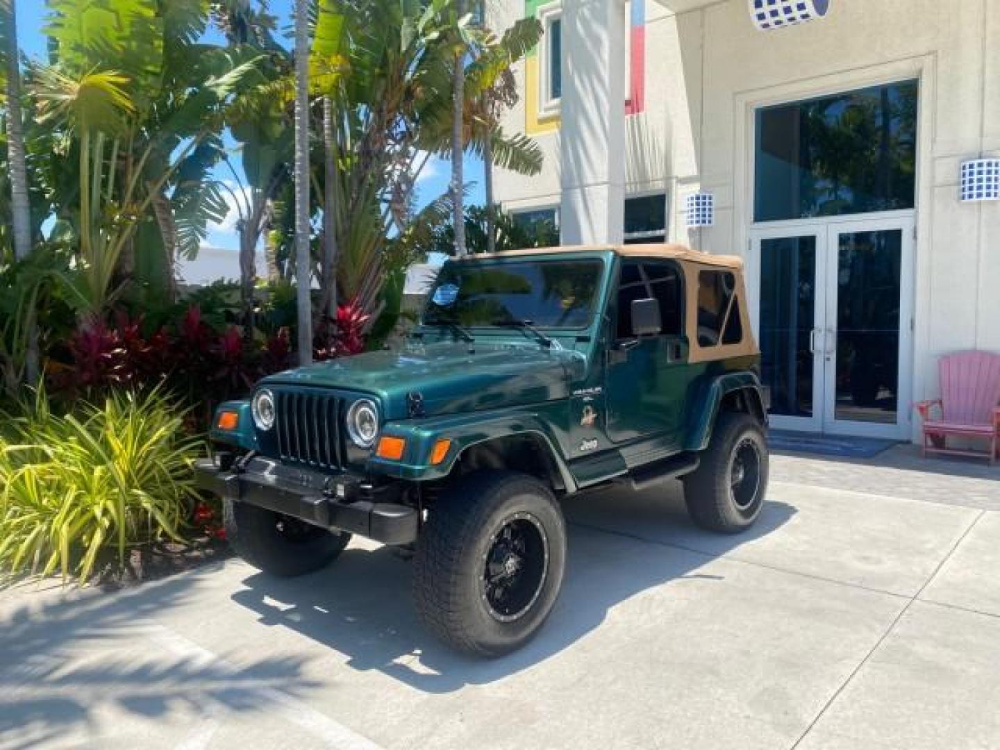 1999 Forest Green Pearl /Camel/Dark Green Jeep Wrangler Sahara AUYO AC 6 CYL LOW MILES 47,009 (1J4FY49S0XP) with an 4.0L SMPI I6 Power Tech Engine engine, Automatic transmission, located at 4701 North Dixie Hwy, Pompano Beach, FL, 33064, (954) 422-2889, 26.240938, -80.123474 - OUR WEBPAGE FLORIDACARS1.COM HAS OVER 100 PHOTOS AND FREE CARFAX LINK 1999 Jeep Wrangler Sahara Utility (Blazer, Jimmy, Scout, etc.) 4.0L I6 F Gasoline 20 MPG Rear Wheel Drive w/ 4X4 Features 4WD/AWD ABS Brakes Air Conditioning Alloy Wheels AM/FM Stereo Automatic Transmission Cassette Player CD Audi - Photo#28