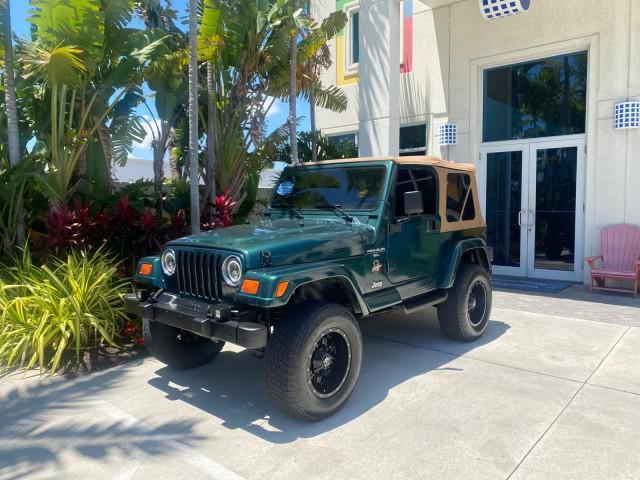 1999 Forest Green Pearl /Camel/Dark Green Jeep Wrangler Sahara AUYO AC 6 CYL LOW MILES 47,009 (1J4FY49S0XP) with an 4.0L SMPI I6 Power Tech Engine engine, Automatic transmission, located at 4701 North Dixie Hwy, Pompano Beach, FL, 33064, (954) 422-2889, 26.240938, -80.123474 - OUR WEBPAGE FLORIDACARS1.COM HAS OVER 100 PHOTOS AND FREE CARFAX LINK 1999 Jeep Wrangler Sahara Utility (Blazer, Jimmy, Scout, etc.) 4.0L I6 F Gasoline 20 MPG Rear Wheel Drive w/ 4X4 Features 4WD/AWD ABS Brakes Air Conditioning Alloy Wheels AM/FM Stereo Automatic Transmission Cassette Player CD Audi - Photo#28