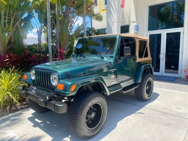 1999 Forest Green Pearl /Camel/Dark Green Jeep Wrangler Sahara AUYO AC 6 CYL LOW MILES 47,009 (1J4FY49S0XP) with an 4.0L SMPI I6 Power Tech Engine engine, Automatic transmission, located at 4701 North Dixie Hwy, Pompano Beach, FL, 33064, (954) 422-2889, 26.240938, -80.123474 - OUR WEBPAGE FLORIDACARS1.COM HAS OVER 100 PHOTOS AND FREE CARFAX LINK 1999 Jeep Wrangler Sahara Utility (Blazer, Jimmy, Scout, etc.) 4.0L I6 F Gasoline 20 MPG Rear Wheel Drive w/ 4X4 Features 4WD/AWD ABS Brakes Air Conditioning Alloy Wheels AM/FM Stereo Automatic Transmission Cassette Player CD Audi - Photo#29