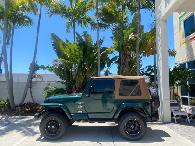 1999 Forest Green Pearl /Camel/Dark Green Jeep Wrangler Sahara AUYO AC 6 CYL LOW MILES 47,009 (1J4FY49S0XP) with an 4.0L SMPI I6 Power Tech Engine engine, Automatic transmission, located at 4701 North Dixie Hwy, Pompano Beach, FL, 33064, (954) 422-2889, 26.240938, -80.123474 - OUR WEBPAGE FLORIDACARS1.COM HAS OVER 100 PHOTOS AND FREE CARFAX LINK 1999 Jeep Wrangler Sahara Utility (Blazer, Jimmy, Scout, etc.) 4.0L I6 F Gasoline 20 MPG Rear Wheel Drive w/ 4X4 Features 4WD/AWD ABS Brakes Air Conditioning Alloy Wheels AM/FM Stereo Automatic Transmission Cassette Player CD Audi - Photo#30
