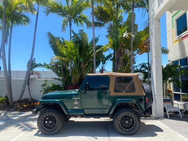 1999 Forest Green Pearl /Camel/Dark Green Jeep Wrangler Sahara AUYO AC 6 CYL LOW MILES 47,009 (1J4FY49S0XP) with an 4.0L SMPI I6 Power Tech Engine engine, Automatic transmission, located at 4701 North Dixie Hwy, Pompano Beach, FL, 33064, (954) 422-2889, 26.240938, -80.123474 - OUR WEBPAGE FLORIDACARS1.COM HAS OVER 100 PHOTOS AND FREE CARFAX LINK 1999 Jeep Wrangler Sahara Utility (Blazer, Jimmy, Scout, etc.) 4.0L I6 F Gasoline 20 MPG Rear Wheel Drive w/ 4X4 Features 4WD/AWD ABS Brakes Air Conditioning Alloy Wheels AM/FM Stereo Automatic Transmission Cassette Player CD Audi - Photo#31