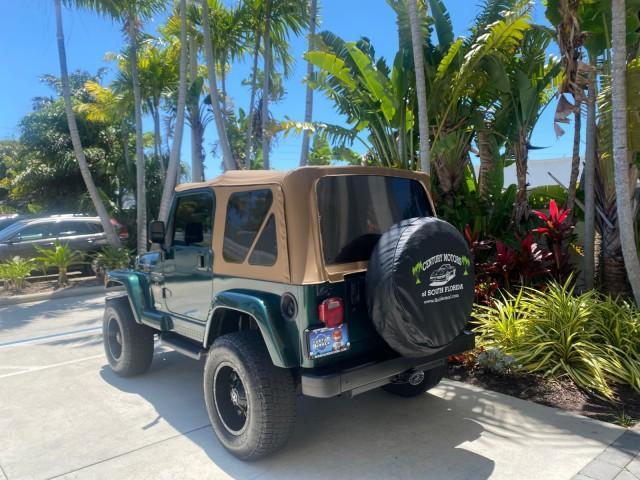 1999 Forest Green Pearl /Camel/Dark Green Jeep Wrangler Sahara AUYO AC 6 CYL LOW MILES 47,009 (1J4FY49S0XP) with an 4.0L SMPI I6 Power Tech Engine engine, Automatic transmission, located at 4701 North Dixie Hwy, Pompano Beach, FL, 33064, (954) 422-2889, 26.240938, -80.123474 - OUR WEBPAGE FLORIDACARS1.COM HAS OVER 100 PHOTOS AND FREE CARFAX LINK 1999 Jeep Wrangler Sahara Utility (Blazer, Jimmy, Scout, etc.) 4.0L I6 F Gasoline 20 MPG Rear Wheel Drive w/ 4X4 Features 4WD/AWD ABS Brakes Air Conditioning Alloy Wheels AM/FM Stereo Automatic Transmission Cassette Player CD Audi - Photo#32