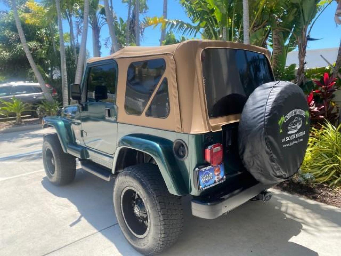 1999 Forest Green Pearl /Camel/Dark Green Jeep Wrangler Sahara AUYO AC 6 CYL LOW MILES 47,009 (1J4FY49S0XP) with an 4.0L SMPI I6 Power Tech Engine engine, Automatic transmission, located at 4701 North Dixie Hwy, Pompano Beach, FL, 33064, (954) 422-2889, 26.240938, -80.123474 - OUR WEBPAGE FLORIDACARS1.COM HAS OVER 100 PHOTOS AND FREE CARFAX LINK 1999 Jeep Wrangler Sahara Utility (Blazer, Jimmy, Scout, etc.) 4.0L I6 F Gasoline 20 MPG Rear Wheel Drive w/ 4X4 Features 4WD/AWD ABS Brakes Air Conditioning Alloy Wheels AM/FM Stereo Automatic Transmission Cassette Player CD Audi - Photo#33
