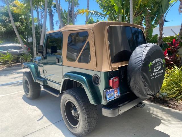 1999 Forest Green Pearl /Camel/Dark Green Jeep Wrangler Sahara AUYO AC 6 CYL LOW MILES 47,009 (1J4FY49S0XP) with an 4.0L SMPI I6 Power Tech Engine engine, Automatic transmission, located at 4701 North Dixie Hwy, Pompano Beach, FL, 33064, (954) 422-2889, 26.240938, -80.123474 - OUR WEBPAGE FLORIDACARS1.COM HAS OVER 100 PHOTOS AND FREE CARFAX LINK 1999 Jeep Wrangler Sahara Utility (Blazer, Jimmy, Scout, etc.) 4.0L I6 F Gasoline 20 MPG Rear Wheel Drive w/ 4X4 Features 4WD/AWD ABS Brakes Air Conditioning Alloy Wheels AM/FM Stereo Automatic Transmission Cassette Player CD Audi - Photo#33