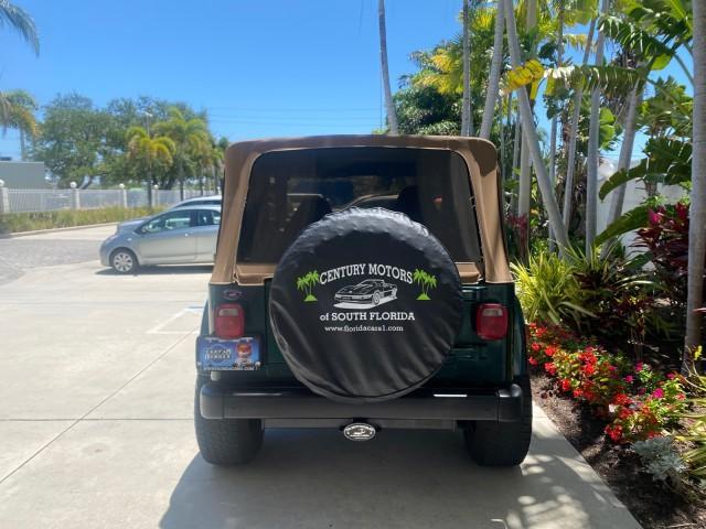 1999 Forest Green Pearl /Camel/Dark Green Jeep Wrangler Sahara AUYO AC 6 CYL LOW MILES 47,009 (1J4FY49S0XP) with an 4.0L SMPI I6 Power Tech Engine engine, Automatic transmission, located at 4701 North Dixie Hwy, Pompano Beach, FL, 33064, (954) 422-2889, 26.240938, -80.123474 - OUR WEBPAGE FLORIDACARS1.COM HAS OVER 100 PHOTOS AND FREE CARFAX LINK 1999 Jeep Wrangler Sahara Utility (Blazer, Jimmy, Scout, etc.) 4.0L I6 F Gasoline 20 MPG Rear Wheel Drive w/ 4X4 Features 4WD/AWD ABS Brakes Air Conditioning Alloy Wheels AM/FM Stereo Automatic Transmission Cassette Player CD Audi - Photo#34