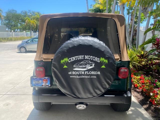 1999 Forest Green Pearl /Camel/Dark Green Jeep Wrangler Sahara AUYO AC 6 CYL LOW MILES 47,009 (1J4FY49S0XP) with an 4.0L SMPI I6 Power Tech Engine engine, Automatic transmission, located at 4701 North Dixie Hwy, Pompano Beach, FL, 33064, (954) 422-2889, 26.240938, -80.123474 - OUR WEBPAGE FLORIDACARS1.COM HAS OVER 100 PHOTOS AND FREE CARFAX LINK 1999 Jeep Wrangler Sahara Utility (Blazer, Jimmy, Scout, etc.) 4.0L I6 F Gasoline 20 MPG Rear Wheel Drive w/ 4X4 Features 4WD/AWD ABS Brakes Air Conditioning Alloy Wheels AM/FM Stereo Automatic Transmission Cassette Player CD Audi - Photo#35