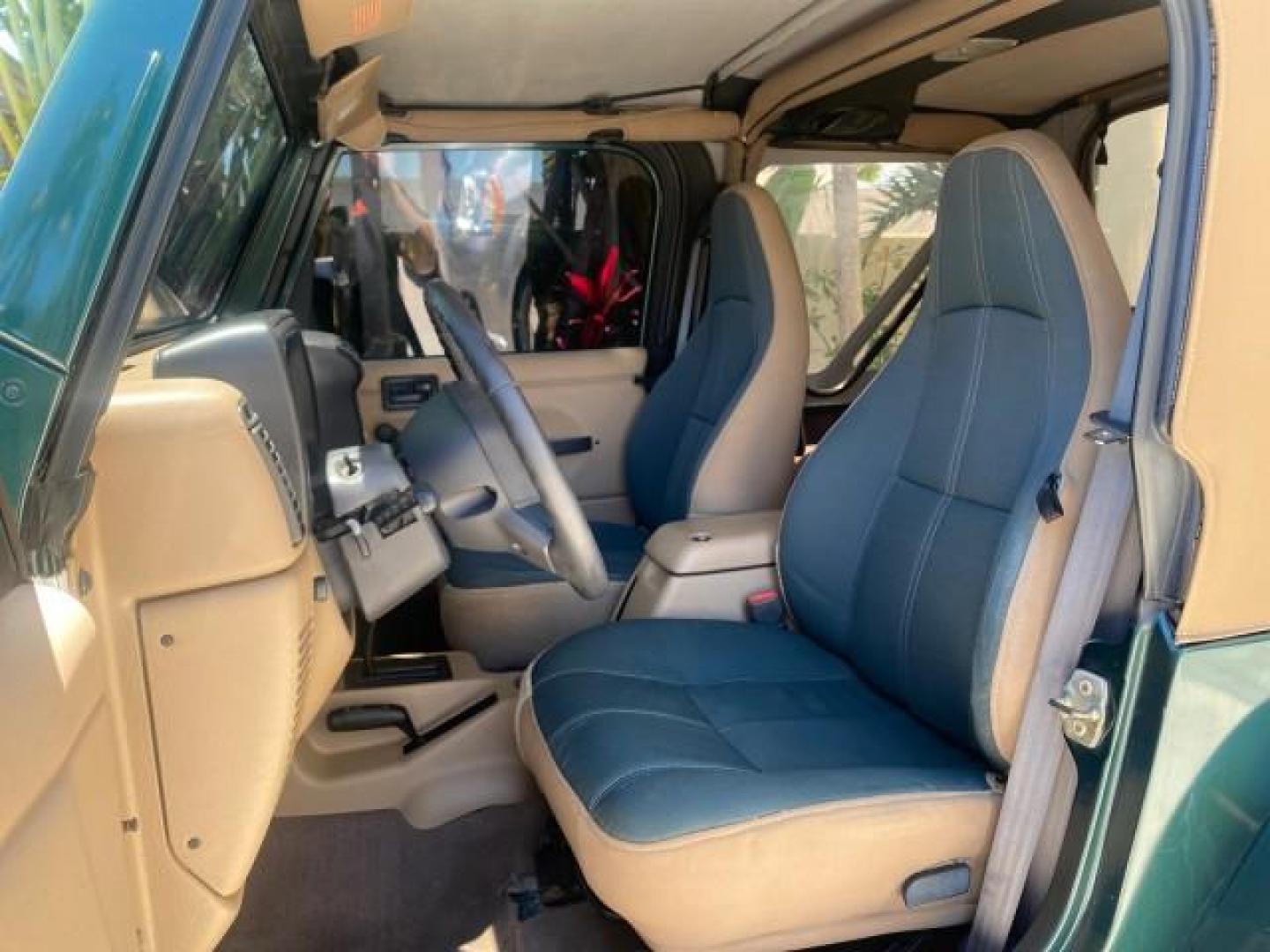 1999 Forest Green Pearl /Camel/Dark Green Jeep Wrangler Sahara AUYO AC 6 CYL LOW MILES 47,009 (1J4FY49S0XP) with an 4.0L SMPI I6 Power Tech Engine engine, Automatic transmission, located at 4701 North Dixie Hwy, Pompano Beach, FL, 33064, (954) 422-2889, 26.240938, -80.123474 - OUR WEBPAGE FLORIDACARS1.COM HAS OVER 100 PHOTOS AND FREE CARFAX LINK 1999 Jeep Wrangler Sahara Utility (Blazer, Jimmy, Scout, etc.) 4.0L I6 F Gasoline 20 MPG Rear Wheel Drive w/ 4X4 Features 4WD/AWD ABS Brakes Air Conditioning Alloy Wheels AM/FM Stereo Automatic Transmission Cassette Player CD Audi - Photo#46
