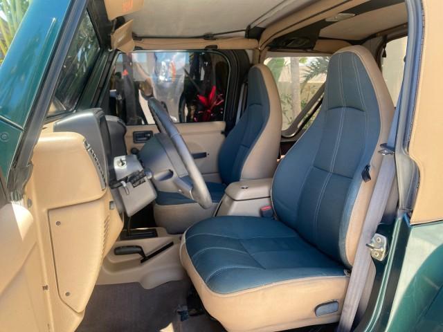 1999 Forest Green Pearl /Camel/Dark Green Jeep Wrangler Sahara AUYO AC 6 CYL LOW MILES 47,009 (1J4FY49S0XP) with an 4.0L SMPI I6 Power Tech Engine engine, Automatic transmission, located at 4701 North Dixie Hwy, Pompano Beach, FL, 33064, (954) 422-2889, 26.240938, -80.123474 - OUR WEBPAGE FLORIDACARS1.COM HAS OVER 100 PHOTOS AND FREE CARFAX LINK 1999 Jeep Wrangler Sahara Utility (Blazer, Jimmy, Scout, etc.) 4.0L I6 F Gasoline 20 MPG Rear Wheel Drive w/ 4X4 Features 4WD/AWD ABS Brakes Air Conditioning Alloy Wheels AM/FM Stereo Automatic Transmission Cassette Player CD Audi - Photo#46