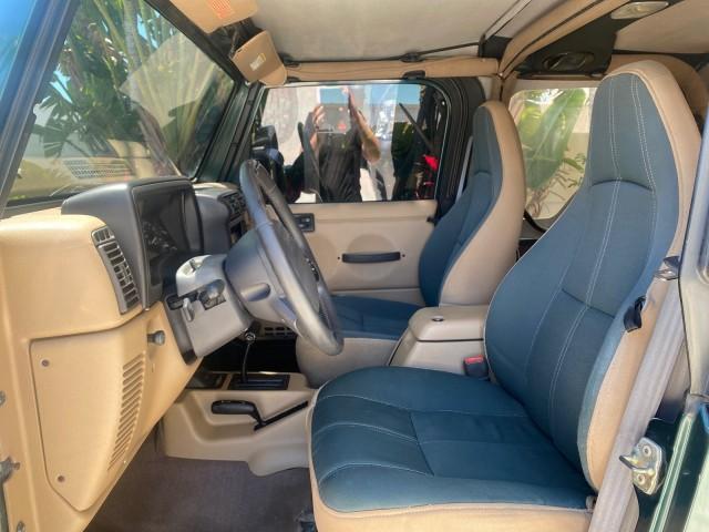 1999 Forest Green Pearl /Camel/Dark Green Jeep Wrangler Sahara AUYO AC 6 CYL LOW MILES 47,009 (1J4FY49S0XP) with an 4.0L SMPI I6 Power Tech Engine engine, Automatic transmission, located at 4701 North Dixie Hwy, Pompano Beach, FL, 33064, (954) 422-2889, 26.240938, -80.123474 - OUR WEBPAGE FLORIDACARS1.COM HAS OVER 100 PHOTOS AND FREE CARFAX LINK 1999 Jeep Wrangler Sahara Utility (Blazer, Jimmy, Scout, etc.) 4.0L I6 F Gasoline 20 MPG Rear Wheel Drive w/ 4X4 Features 4WD/AWD ABS Brakes Air Conditioning Alloy Wheels AM/FM Stereo Automatic Transmission Cassette Player CD Audi - Photo#47