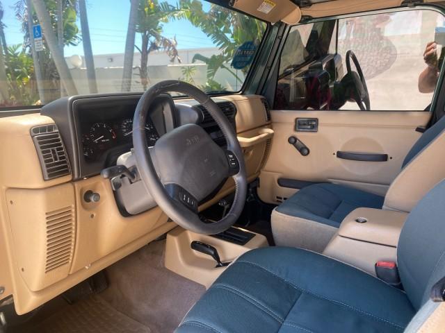 1999 Forest Green Pearl /Camel/Dark Green Jeep Wrangler Sahara AUYO AC 6 CYL LOW MILES 47,009 (1J4FY49S0XP) with an 4.0L SMPI I6 Power Tech Engine engine, Automatic transmission, located at 4701 North Dixie Hwy, Pompano Beach, FL, 33064, (954) 422-2889, 26.240938, -80.123474 - OUR WEBPAGE FLORIDACARS1.COM HAS OVER 100 PHOTOS AND FREE CARFAX LINK 1999 Jeep Wrangler Sahara Utility (Blazer, Jimmy, Scout, etc.) 4.0L I6 F Gasoline 20 MPG Rear Wheel Drive w/ 4X4 Features 4WD/AWD ABS Brakes Air Conditioning Alloy Wheels AM/FM Stereo Automatic Transmission Cassette Player CD Audi - Photo#49
