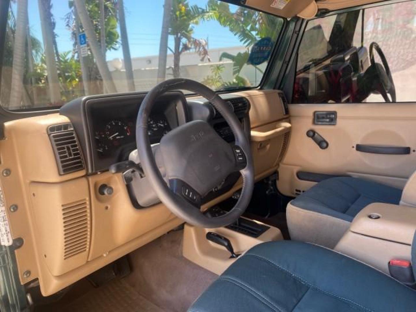 1999 Forest Green Pearl /Camel/Dark Green Jeep Wrangler Sahara AUYO AC 6 CYL LOW MILES 47,009 (1J4FY49S0XP) with an 4.0L SMPI I6 Power Tech Engine engine, Automatic transmission, located at 4701 North Dixie Hwy, Pompano Beach, FL, 33064, (954) 422-2889, 26.240938, -80.123474 - OUR WEBPAGE FLORIDACARS1.COM HAS OVER 100 PHOTOS AND FREE CARFAX LINK 1999 Jeep Wrangler Sahara Utility (Blazer, Jimmy, Scout, etc.) 4.0L I6 F Gasoline 20 MPG Rear Wheel Drive w/ 4X4 Features 4WD/AWD ABS Brakes Air Conditioning Alloy Wheels AM/FM Stereo Automatic Transmission Cassette Player CD Audi - Photo#50