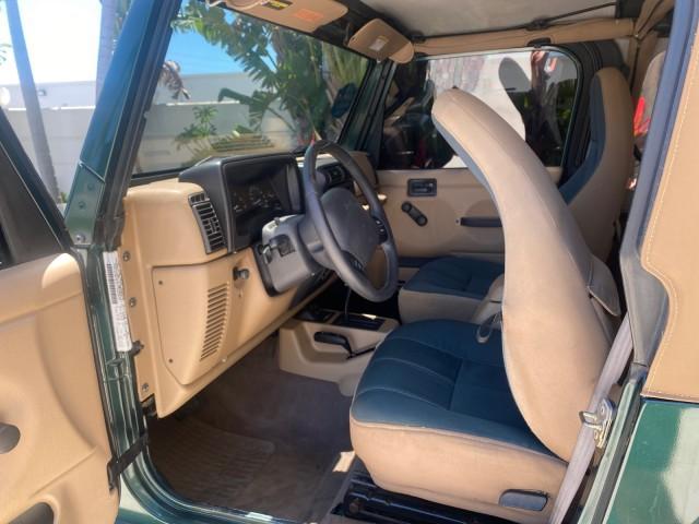 1999 Forest Green Pearl /Camel/Dark Green Jeep Wrangler Sahara AUYO AC 6 CYL LOW MILES 47,009 (1J4FY49S0XP) with an 4.0L SMPI I6 Power Tech Engine engine, Automatic transmission, located at 4701 North Dixie Hwy, Pompano Beach, FL, 33064, (954) 422-2889, 26.240938, -80.123474 - OUR WEBPAGE FLORIDACARS1.COM HAS OVER 100 PHOTOS AND FREE CARFAX LINK 1999 Jeep Wrangler Sahara Utility (Blazer, Jimmy, Scout, etc.) 4.0L I6 F Gasoline 20 MPG Rear Wheel Drive w/ 4X4 Features 4WD/AWD ABS Brakes Air Conditioning Alloy Wheels AM/FM Stereo Automatic Transmission Cassette Player CD Audi - Photo#73