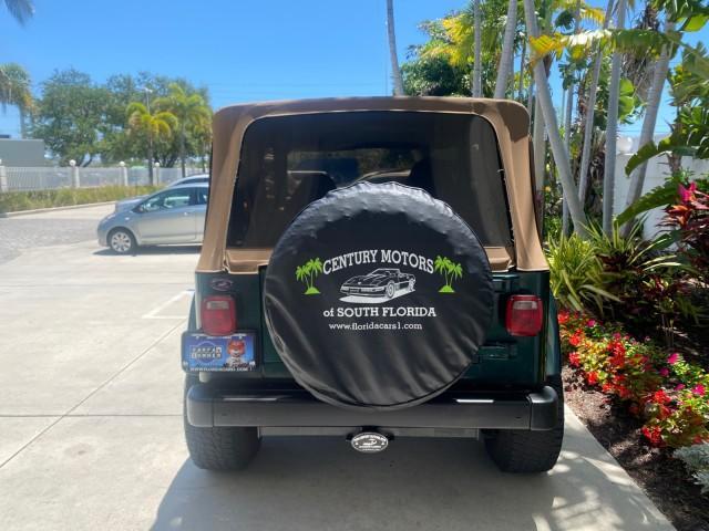 1999 Forest Green Pearl /Camel/Dark Green Jeep Wrangler Sahara AUYO AC 6 CYL LOW MILES 47,009 (1J4FY49S0XP) with an 4.0L SMPI I6 Power Tech Engine engine, Automatic transmission, located at 4701 North Dixie Hwy, Pompano Beach, FL, 33064, (954) 422-2889, 26.240938, -80.123474 - OUR WEBPAGE FLORIDACARS1.COM HAS OVER 100 PHOTOS AND FREE CARFAX LINK 1999 Jeep Wrangler Sahara Utility (Blazer, Jimmy, Scout, etc.) 4.0L I6 F Gasoline 20 MPG Rear Wheel Drive w/ 4X4 Features 4WD/AWD ABS Brakes Air Conditioning Alloy Wheels AM/FM Stereo Automatic Transmission Cassette Player CD Audi - Photo#82