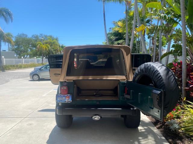 1999 Forest Green Pearl /Camel/Dark Green Jeep Wrangler Sahara AUYO AC 6 CYL LOW MILES 47,009 (1J4FY49S0XP) with an 4.0L SMPI I6 Power Tech Engine engine, Automatic transmission, located at 4701 North Dixie Hwy, Pompano Beach, FL, 33064, (954) 422-2889, 26.240938, -80.123474 - OUR WEBPAGE FLORIDACARS1.COM HAS OVER 100 PHOTOS AND FREE CARFAX LINK 1999 Jeep Wrangler Sahara Utility (Blazer, Jimmy, Scout, etc.) 4.0L I6 F Gasoline 20 MPG Rear Wheel Drive w/ 4X4 Features 4WD/AWD ABS Brakes Air Conditioning Alloy Wheels AM/FM Stereo Automatic Transmission Cassette Player CD Audi - Photo#85