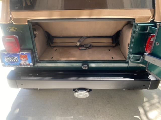 1999 Forest Green Pearl /Camel/Dark Green Jeep Wrangler Sahara AUYO AC 6 CYL LOW MILES 47,009 (1J4FY49S0XP) with an 4.0L SMPI I6 Power Tech Engine engine, Automatic transmission, located at 4701 North Dixie Hwy, Pompano Beach, FL, 33064, (954) 422-2889, 26.240938, -80.123474 - OUR WEBPAGE FLORIDACARS1.COM HAS OVER 100 PHOTOS AND FREE CARFAX LINK 1999 Jeep Wrangler Sahara Utility (Blazer, Jimmy, Scout, etc.) 4.0L I6 F Gasoline 20 MPG Rear Wheel Drive w/ 4X4 Features 4WD/AWD ABS Brakes Air Conditioning Alloy Wheels AM/FM Stereo Automatic Transmission Cassette Player CD Audi - Photo#87