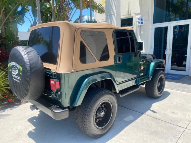 1999 Forest Green Pearl /Camel/Dark Green Jeep Wrangler Sahara AUYO AC 6 CYL LOW MILES 47,009 (1J4FY49S0XP) with an 4.0L SMPI I6 Power Tech Engine engine, Automatic transmission, located at 4701 North Dixie Hwy, Pompano Beach, FL, 33064, (954) 422-2889, 26.240938, -80.123474 - OUR WEBPAGE FLORIDACARS1.COM HAS OVER 100 PHOTOS AND FREE CARFAX LINK 1999 Jeep Wrangler Sahara Utility (Blazer, Jimmy, Scout, etc.) 4.0L I6 F Gasoline 20 MPG Rear Wheel Drive w/ 4X4 Features 4WD/AWD ABS Brakes Air Conditioning Alloy Wheels AM/FM Stereo Automatic Transmission Cassette Player CD Audi - Photo#91