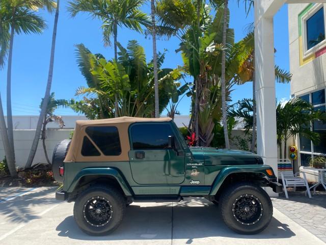 1999 Forest Green Pearl /Camel/Dark Green Jeep Wrangler Sahara AUYO AC 6 CYL LOW MILES 47,009 (1J4FY49S0XP) with an 4.0L SMPI I6 Power Tech Engine engine, Automatic transmission, located at 4701 North Dixie Hwy, Pompano Beach, FL, 33064, (954) 422-2889, 26.240938, -80.123474 - OUR WEBPAGE FLORIDACARS1.COM HAS OVER 100 PHOTOS AND FREE CARFAX LINK 1999 Jeep Wrangler Sahara Utility (Blazer, Jimmy, Scout, etc.) 4.0L I6 F Gasoline 20 MPG Rear Wheel Drive w/ 4X4 Features 4WD/AWD ABS Brakes Air Conditioning Alloy Wheels AM/FM Stereo Automatic Transmission Cassette Player CD Audi - Photo#92
