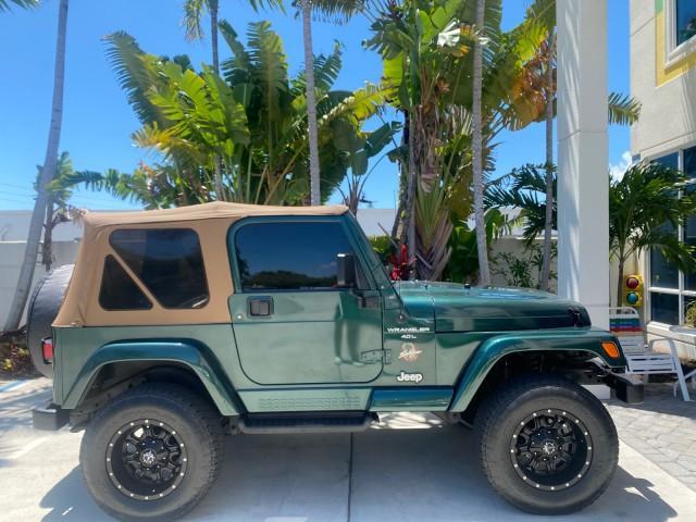 1999 Forest Green Pearl /Camel/Dark Green Jeep Wrangler Sahara AUYO AC 6 CYL LOW MILES 47,009 (1J4FY49S0XP) with an 4.0L SMPI I6 Power Tech Engine engine, Automatic transmission, located at 4701 North Dixie Hwy, Pompano Beach, FL, 33064, (954) 422-2889, 26.240938, -80.123474 - OUR WEBPAGE FLORIDACARS1.COM HAS OVER 100 PHOTOS AND FREE CARFAX LINK 1999 Jeep Wrangler Sahara Utility (Blazer, Jimmy, Scout, etc.) 4.0L I6 F Gasoline 20 MPG Rear Wheel Drive w/ 4X4 Features 4WD/AWD ABS Brakes Air Conditioning Alloy Wheels AM/FM Stereo Automatic Transmission Cassette Player CD Audi - Photo#93