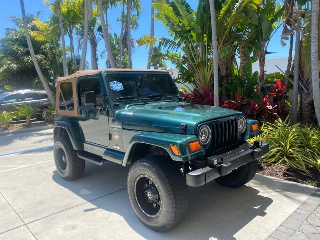 1999 Forest Green Pearl /Camel/Dark Green Jeep Wrangler Sahara AUYO AC 6 CYL LOW MILES 47,009 (1J4FY49S0XP) with an 4.0L SMPI I6 Power Tech Engine engine, Automatic transmission, located at 4701 North Dixie Hwy, Pompano Beach, FL, 33064, (954) 422-2889, 26.240938, -80.123474 - OUR WEBPAGE FLORIDACARS1.COM HAS OVER 100 PHOTOS AND FREE CARFAX LINK 1999 Jeep Wrangler Sahara Utility (Blazer, Jimmy, Scout, etc.) 4.0L I6 F Gasoline 20 MPG Rear Wheel Drive w/ 4X4 Features 4WD/AWD ABS Brakes Air Conditioning Alloy Wheels AM/FM Stereo Automatic Transmission Cassette Player CD Audi - Photo#94