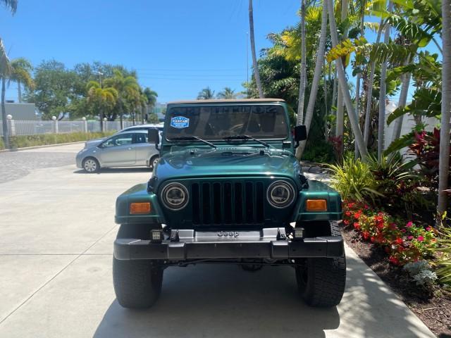 1999 Forest Green Pearl /Camel/Dark Green Jeep Wrangler Sahara AUYO AC 6 CYL LOW MILES 47,009 (1J4FY49S0XP) with an 4.0L SMPI I6 Power Tech Engine engine, Automatic transmission, located at 4701 North Dixie Hwy, Pompano Beach, FL, 33064, (954) 422-2889, 26.240938, -80.123474 - OUR WEBPAGE FLORIDACARS1.COM HAS OVER 100 PHOTOS AND FREE CARFAX LINK 1999 Jeep Wrangler Sahara Utility (Blazer, Jimmy, Scout, etc.) 4.0L I6 F Gasoline 20 MPG Rear Wheel Drive w/ 4X4 Features 4WD/AWD ABS Brakes Air Conditioning Alloy Wheels AM/FM Stereo Automatic Transmission Cassette Player CD Audi - Photo#96