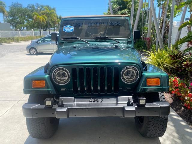 1999 Forest Green Pearl /Camel/Dark Green Jeep Wrangler Sahara AUYO AC 6 CYL LOW MILES 47,009 (1J4FY49S0XP) with an 4.0L SMPI I6 Power Tech Engine engine, Automatic transmission, located at 4701 North Dixie Hwy, Pompano Beach, FL, 33064, (954) 422-2889, 26.240938, -80.123474 - OUR WEBPAGE FLORIDACARS1.COM HAS OVER 100 PHOTOS AND FREE CARFAX LINK 1999 Jeep Wrangler Sahara Utility (Blazer, Jimmy, Scout, etc.) 4.0L I6 F Gasoline 20 MPG Rear Wheel Drive w/ 4X4 Features 4WD/AWD ABS Brakes Air Conditioning Alloy Wheels AM/FM Stereo Automatic Transmission Cassette Player CD Audi - Photo#97