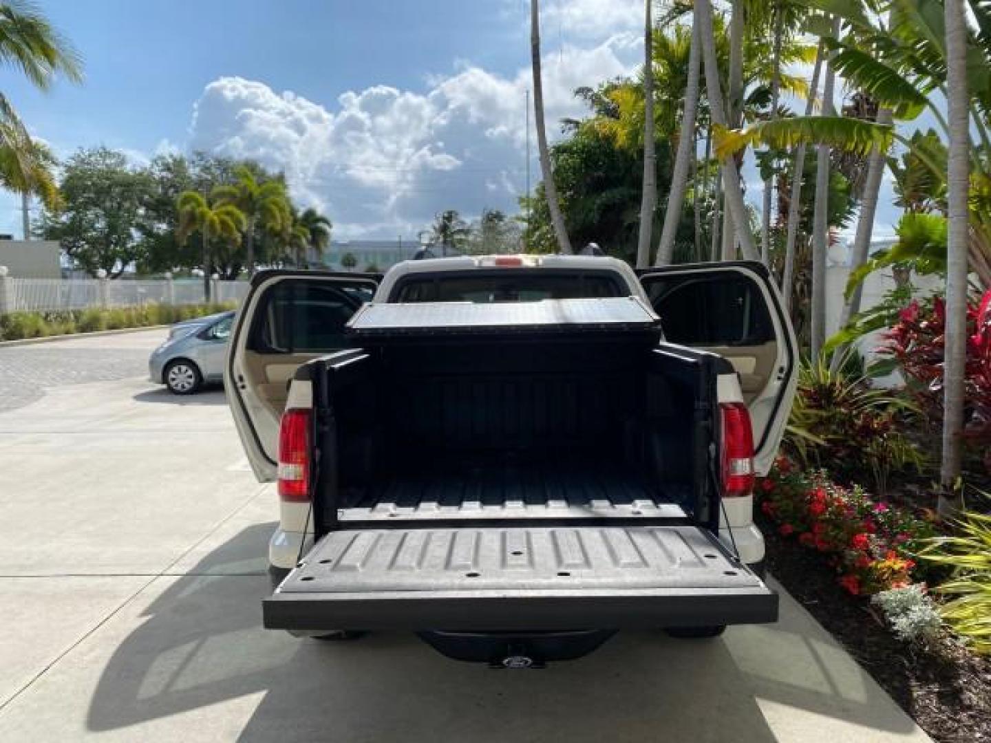 2009 White Suede /Camel Ford Explorer Sport Trac XLT LOW MILES 73,848 (1FMEU31E99U) with an 4.0L SOHC 12-Valve V6 Engine engine, Automatic transmission, located at 4701 North Dixie Hwy, Pompano Beach, FL, 33064, (954) 422-2889, 26.240938, -80.123474 - OUR WEBPAGE FLORIDACARS1.COM HAS OVER 100 PHOTOS AND FREE CARFAX LINK 2009 Ford Explorer Sport Trac XLT Sport Pickup 4.0L V6 F SOHC 12V Gasoline 21 MPG Rear Wheel Drive Features ABS Brakes Air Conditioning Alloy Wheels AM/FM Stereo Automatic Transmission Auxiliary Audio Input CD Audio Cloth Seats Cr - Photo#15