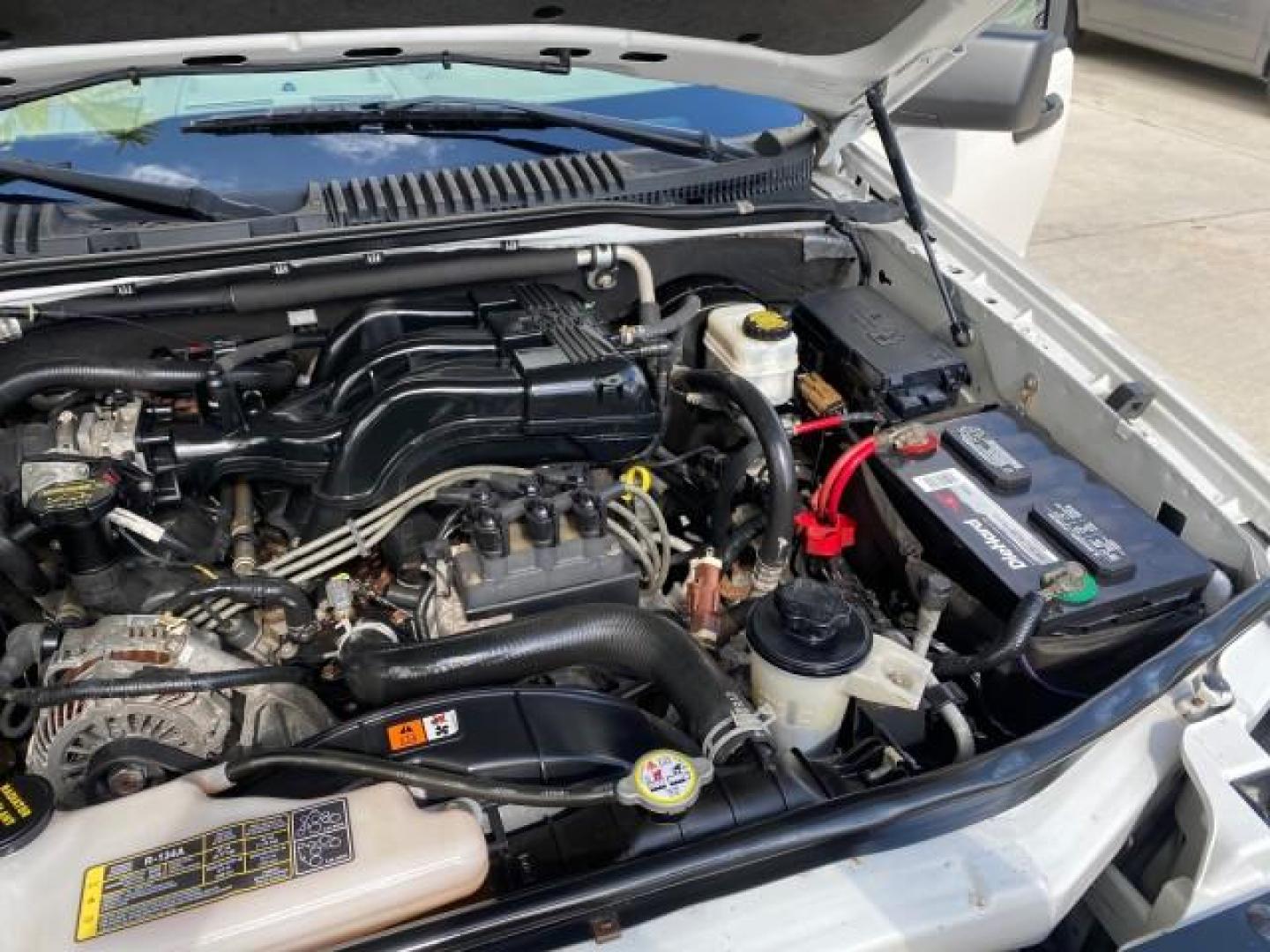 2009 White Suede /Camel Ford Explorer Sport Trac XLT LOW MILES 73,848 (1FMEU31E99U) with an 4.0L SOHC 12-Valve V6 Engine engine, Automatic transmission, located at 4701 North Dixie Hwy, Pompano Beach, FL, 33064, (954) 422-2889, 26.240938, -80.123474 - OUR WEBPAGE FLORIDACARS1.COM HAS OVER 100 PHOTOS AND FREE CARFAX LINK 2009 Ford Explorer Sport Trac XLT Sport Pickup 4.0L V6 F SOHC 12V Gasoline 21 MPG Rear Wheel Drive Features ABS Brakes Air Conditioning Alloy Wheels AM/FM Stereo Automatic Transmission Auxiliary Audio Input CD Audio Cloth Seats Cr - Photo#25