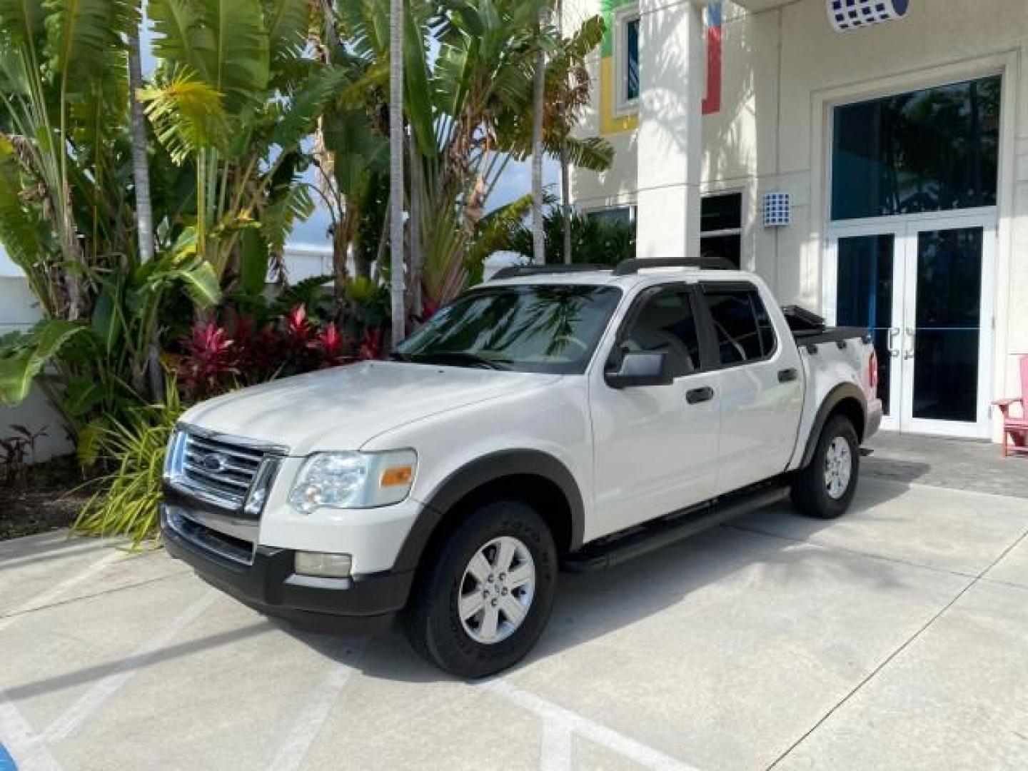 2009 White Suede /Camel Ford Explorer Sport Trac XLT LOW MILES 73,848 (1FMEU31E99U) with an 4.0L SOHC 12-Valve V6 Engine engine, Automatic transmission, located at 4701 North Dixie Hwy, Pompano Beach, FL, 33064, (954) 422-2889, 26.240938, -80.123474 - OUR WEBPAGE FLORIDACARS1.COM HAS OVER 100 PHOTOS AND FREE CARFAX LINK 2009 Ford Explorer Sport Trac XLT Sport Pickup 4.0L V6 F SOHC 12V Gasoline 21 MPG Rear Wheel Drive Features ABS Brakes Air Conditioning Alloy Wheels AM/FM Stereo Automatic Transmission Auxiliary Audio Input CD Audio Cloth Seats Cr - Photo#28