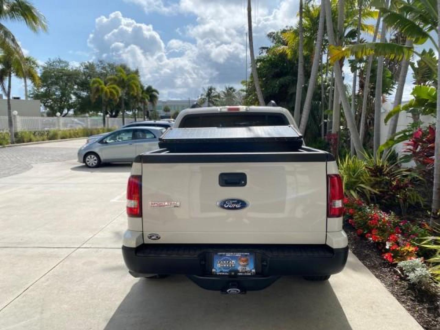 2009 White Suede /Camel Ford Explorer Sport Trac XLT LOW MILES 73,848 (1FMEU31E99U) with an 4.0L SOHC 12-Valve V6 Engine engine, Automatic transmission, located at 4701 North Dixie Hwy, Pompano Beach, FL, 33064, (954) 422-2889, 26.240938, -80.123474 - OUR WEBPAGE FLORIDACARS1.COM HAS OVER 100 PHOTOS AND FREE CARFAX LINK 2009 Ford Explorer Sport Trac XLT Sport Pickup 4.0L V6 F SOHC 12V Gasoline 21 MPG Rear Wheel Drive Features ABS Brakes Air Conditioning Alloy Wheels AM/FM Stereo Automatic Transmission Auxiliary Audio Input CD Audio Cloth Seats Cr - Photo#34