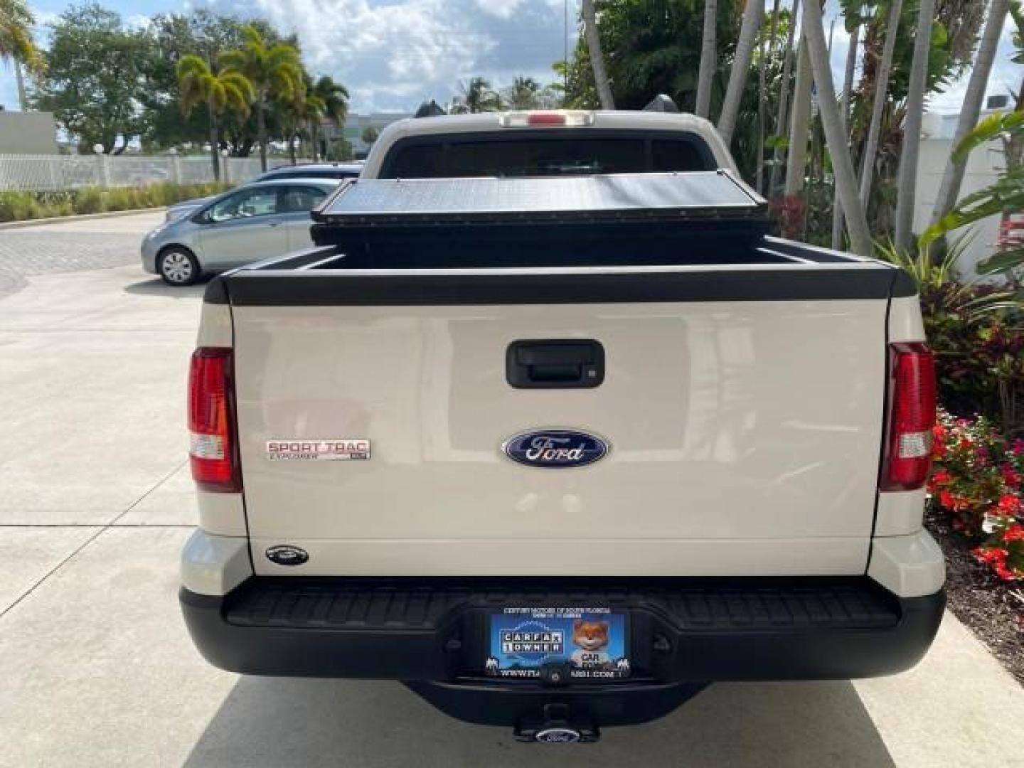 2009 White Suede /Camel Ford Explorer Sport Trac XLT LOW MILES 73,848 (1FMEU31E99U) with an 4.0L SOHC 12-Valve V6 Engine engine, Automatic transmission, located at 4701 North Dixie Hwy, Pompano Beach, FL, 33064, (954) 422-2889, 26.240938, -80.123474 - OUR WEBPAGE FLORIDACARS1.COM HAS OVER 100 PHOTOS AND FREE CARFAX LINK 2009 Ford Explorer Sport Trac XLT Sport Pickup 4.0L V6 F SOHC 12V Gasoline 21 MPG Rear Wheel Drive Features ABS Brakes Air Conditioning Alloy Wheels AM/FM Stereo Automatic Transmission Auxiliary Audio Input CD Audio Cloth Seats Cr - Photo#35