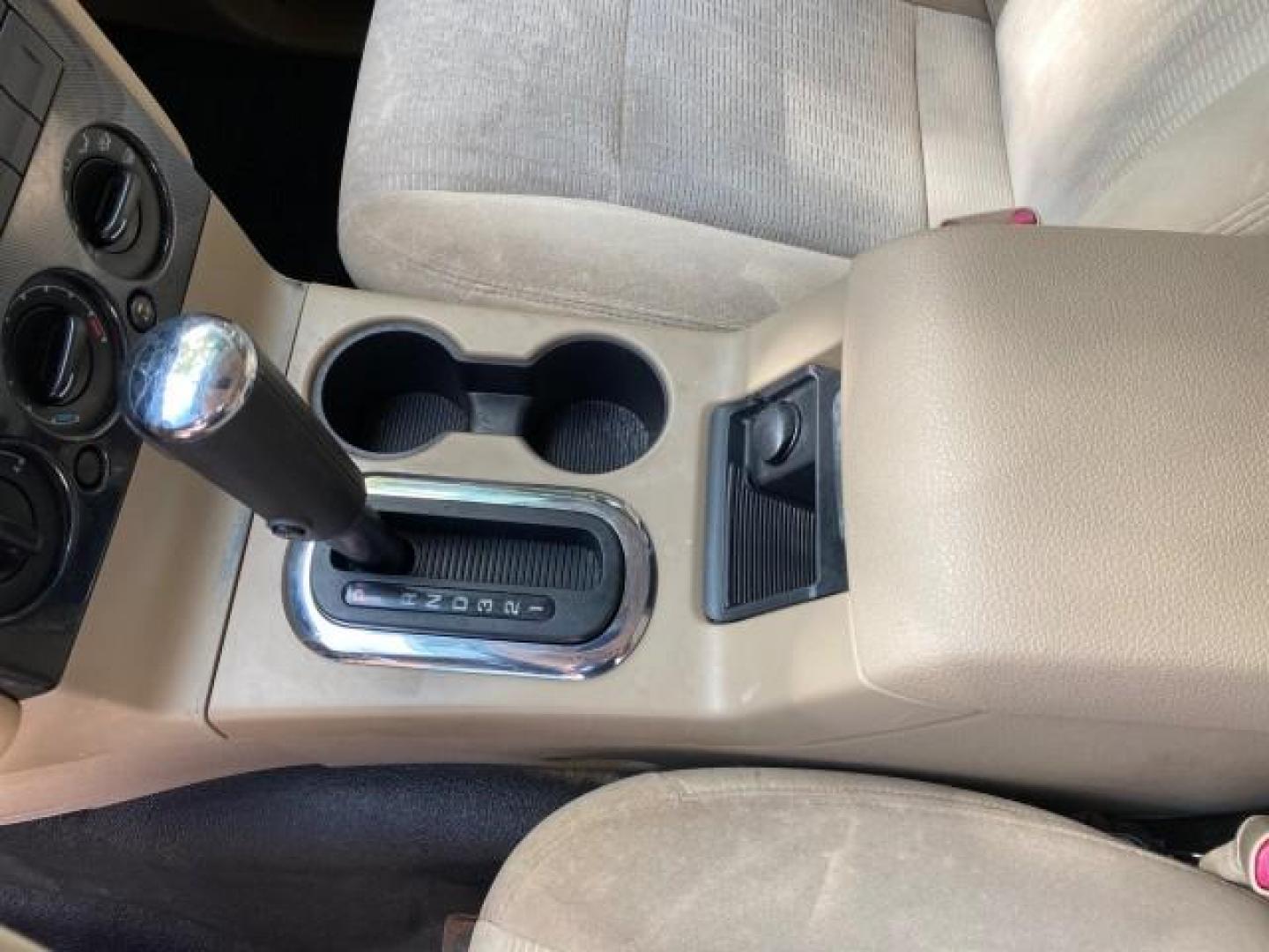 2009 White Suede /Camel Ford Explorer Sport Trac XLT LOW MILES 73,848 (1FMEU31E99U) with an 4.0L SOHC 12-Valve V6 Engine engine, Automatic transmission, located at 4701 North Dixie Hwy, Pompano Beach, FL, 33064, (954) 422-2889, 26.240938, -80.123474 - OUR WEBPAGE FLORIDACARS1.COM HAS OVER 100 PHOTOS AND FREE CARFAX LINK 2009 Ford Explorer Sport Trac XLT Sport Pickup 4.0L V6 F SOHC 12V Gasoline 21 MPG Rear Wheel Drive Features ABS Brakes Air Conditioning Alloy Wheels AM/FM Stereo Automatic Transmission Auxiliary Audio Input CD Audio Cloth Seats Cr - Photo#59