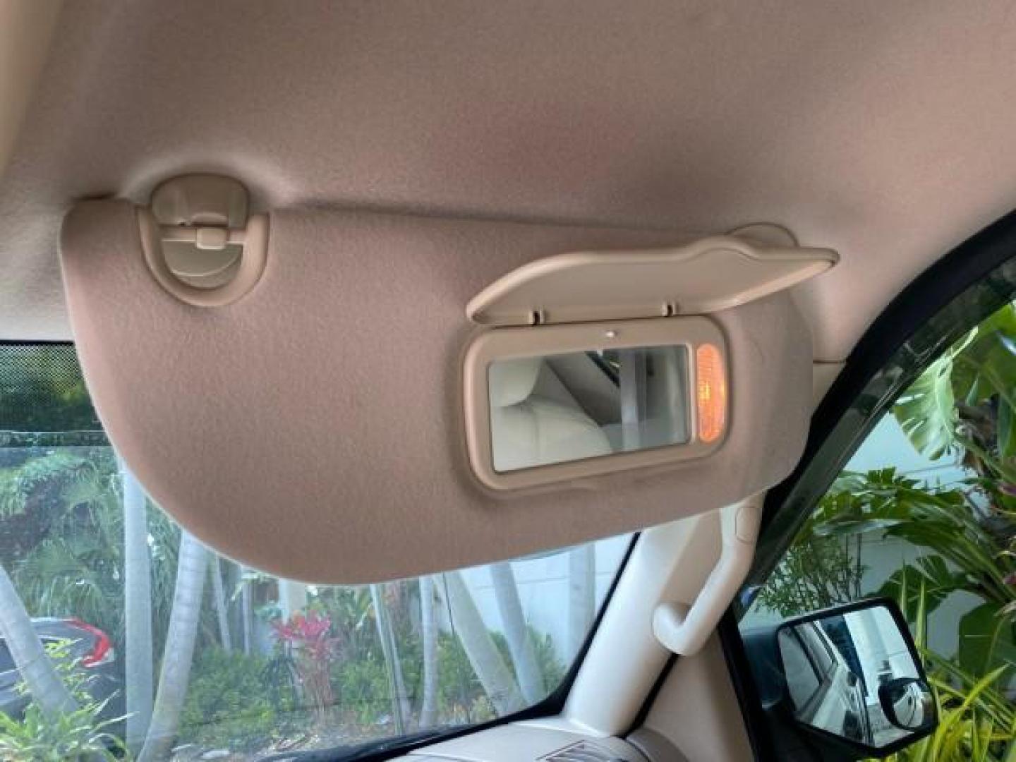 2009 White Suede /Camel Ford Explorer Sport Trac XLT LOW MILES 73,848 (1FMEU31E99U) with an 4.0L SOHC 12-Valve V6 Engine engine, Automatic transmission, located at 4701 North Dixie Hwy, Pompano Beach, FL, 33064, (954) 422-2889, 26.240938, -80.123474 - OUR WEBPAGE FLORIDACARS1.COM HAS OVER 100 PHOTOS AND FREE CARFAX LINK 2009 Ford Explorer Sport Trac XLT Sport Pickup 4.0L V6 F SOHC 12V Gasoline 21 MPG Rear Wheel Drive Features ABS Brakes Air Conditioning Alloy Wheels AM/FM Stereo Automatic Transmission Auxiliary Audio Input CD Audio Cloth Seats Cr - Photo#66
