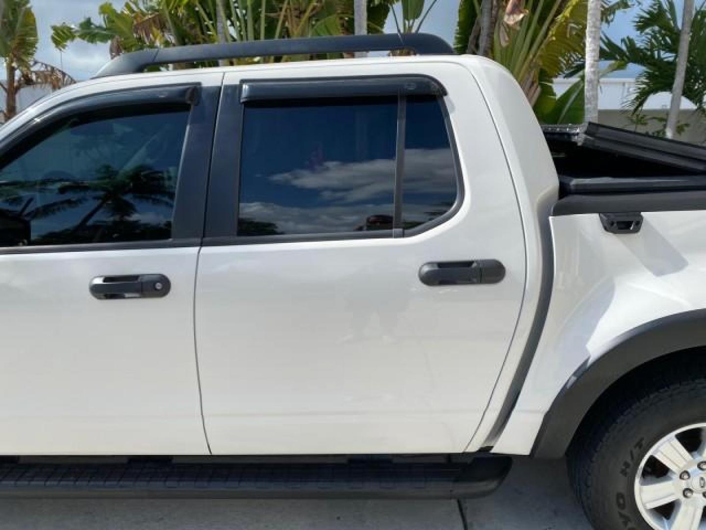 2009 White Suede /Camel Ford Explorer Sport Trac XLT LOW MILES 73,848 (1FMEU31E99U) with an 4.0L SOHC 12-Valve V6 Engine engine, Automatic transmission, located at 4701 North Dixie Hwy, Pompano Beach, FL, 33064, (954) 422-2889, 26.240938, -80.123474 - OUR WEBPAGE FLORIDACARS1.COM HAS OVER 100 PHOTOS AND FREE CARFAX LINK 2009 Ford Explorer Sport Trac XLT Sport Pickup 4.0L V6 F SOHC 12V Gasoline 21 MPG Rear Wheel Drive Features ABS Brakes Air Conditioning Alloy Wheels AM/FM Stereo Automatic Transmission Auxiliary Audio Input CD Audio Cloth Seats Cr - Photo#70