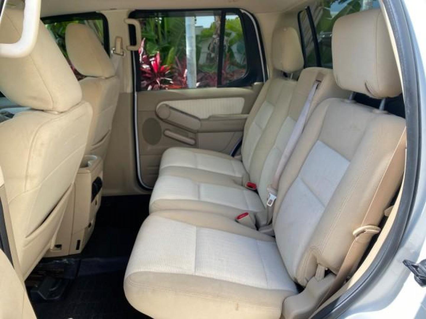 2009 White Suede /Camel Ford Explorer Sport Trac XLT LOW MILES 73,848 (1FMEU31E99U) with an 4.0L SOHC 12-Valve V6 Engine engine, Automatic transmission, located at 4701 North Dixie Hwy, Pompano Beach, FL, 33064, (954) 422-2889, 26.240938, -80.123474 - OUR WEBPAGE FLORIDACARS1.COM HAS OVER 100 PHOTOS AND FREE CARFAX LINK 2009 Ford Explorer Sport Trac XLT Sport Pickup 4.0L V6 F SOHC 12V Gasoline 21 MPG Rear Wheel Drive Features ABS Brakes Air Conditioning Alloy Wheels AM/FM Stereo Automatic Transmission Auxiliary Audio Input CD Audio Cloth Seats Cr - Photo#73