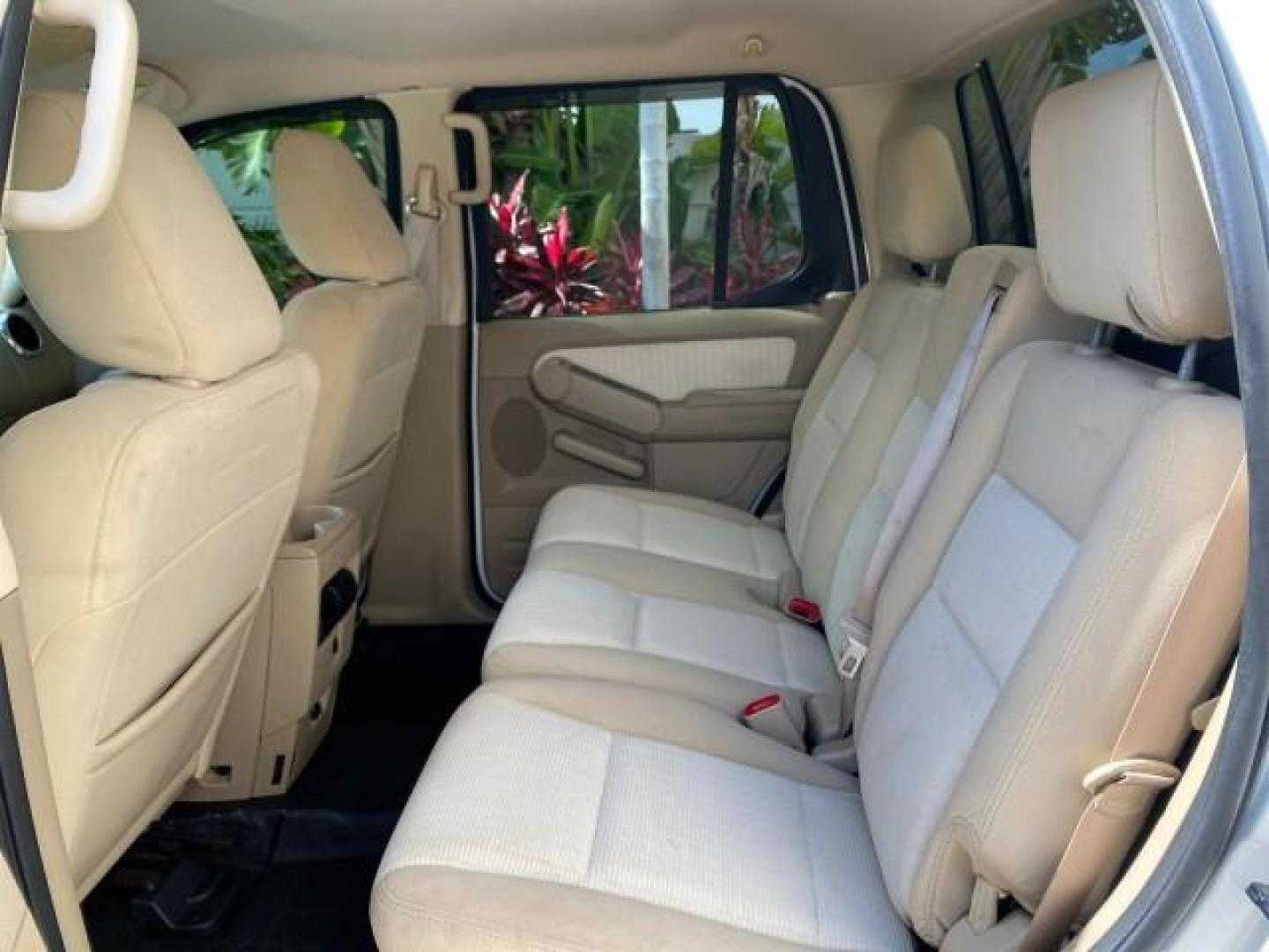 2009 White Suede /Camel Ford Explorer Sport Trac XLT LOW MILES 73,848 (1FMEU31E99U) with an 4.0L SOHC 12-Valve V6 Engine engine, Automatic transmission, located at 4701 North Dixie Hwy, Pompano Beach, FL, 33064, (954) 422-2889, 26.240938, -80.123474 - OUR WEBPAGE FLORIDACARS1.COM HAS OVER 100 PHOTOS AND FREE CARFAX LINK 2009 Ford Explorer Sport Trac XLT Sport Pickup 4.0L V6 F SOHC 12V Gasoline 21 MPG Rear Wheel Drive Features ABS Brakes Air Conditioning Alloy Wheels AM/FM Stereo Automatic Transmission Auxiliary Audio Input CD Audio Cloth Seats Cr - Photo#74