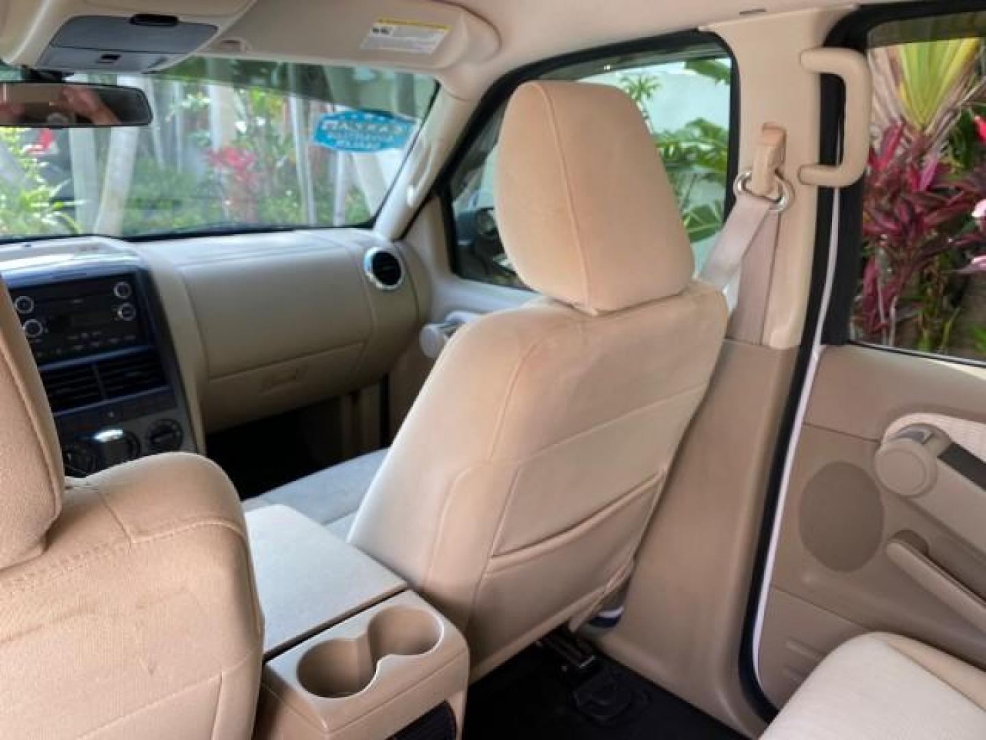 2009 White Suede /Camel Ford Explorer Sport Trac XLT LOW MILES 73,848 (1FMEU31E99U) with an 4.0L SOHC 12-Valve V6 Engine engine, Automatic transmission, located at 4701 North Dixie Hwy, Pompano Beach, FL, 33064, (954) 422-2889, 26.240938, -80.123474 - OUR WEBPAGE FLORIDACARS1.COM HAS OVER 100 PHOTOS AND FREE CARFAX LINK 2009 Ford Explorer Sport Trac XLT Sport Pickup 4.0L V6 F SOHC 12V Gasoline 21 MPG Rear Wheel Drive Features ABS Brakes Air Conditioning Alloy Wheels AM/FM Stereo Automatic Transmission Auxiliary Audio Input CD Audio Cloth Seats Cr - Photo#80
