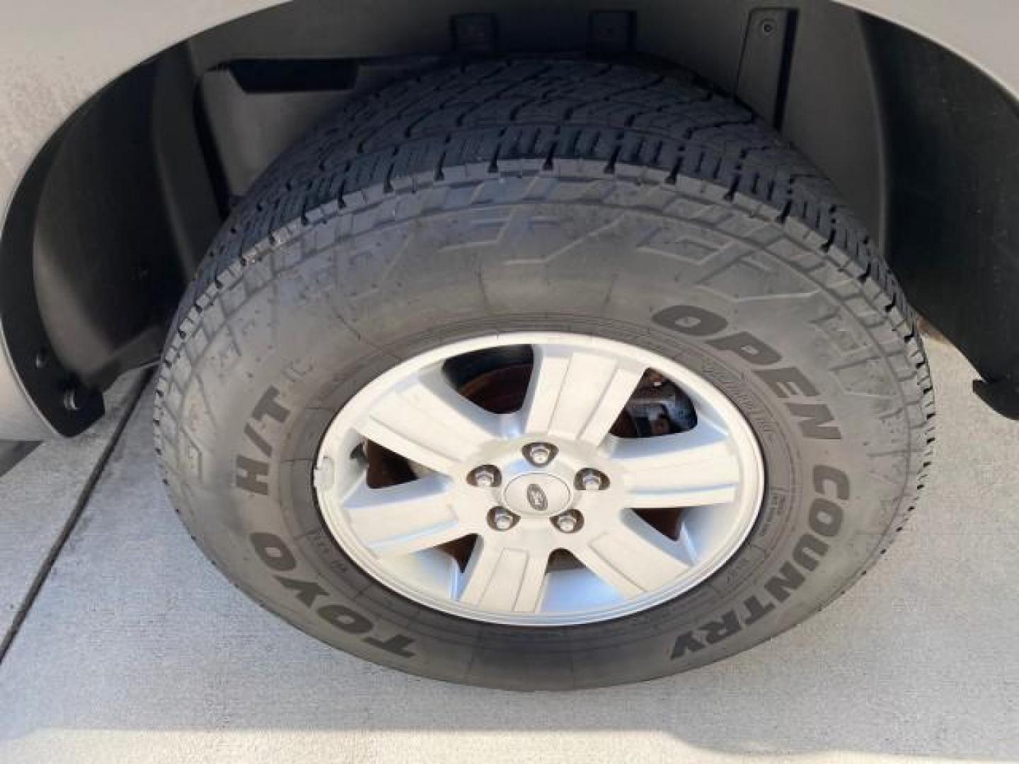 2009 White Suede /Camel Ford Explorer Sport Trac XLT LOW MILES 73,848 (1FMEU31E99U) with an 4.0L SOHC 12-Valve V6 Engine engine, Automatic transmission, located at 4701 North Dixie Hwy, Pompano Beach, FL, 33064, (954) 422-2889, 26.240938, -80.123474 - OUR WEBPAGE FLORIDACARS1.COM HAS OVER 100 PHOTOS AND FREE CARFAX LINK 2009 Ford Explorer Sport Trac XLT Sport Pickup 4.0L V6 F SOHC 12V Gasoline 21 MPG Rear Wheel Drive Features ABS Brakes Air Conditioning Alloy Wheels AM/FM Stereo Automatic Transmission Auxiliary Audio Input CD Audio Cloth Seats Cr - Photo#81