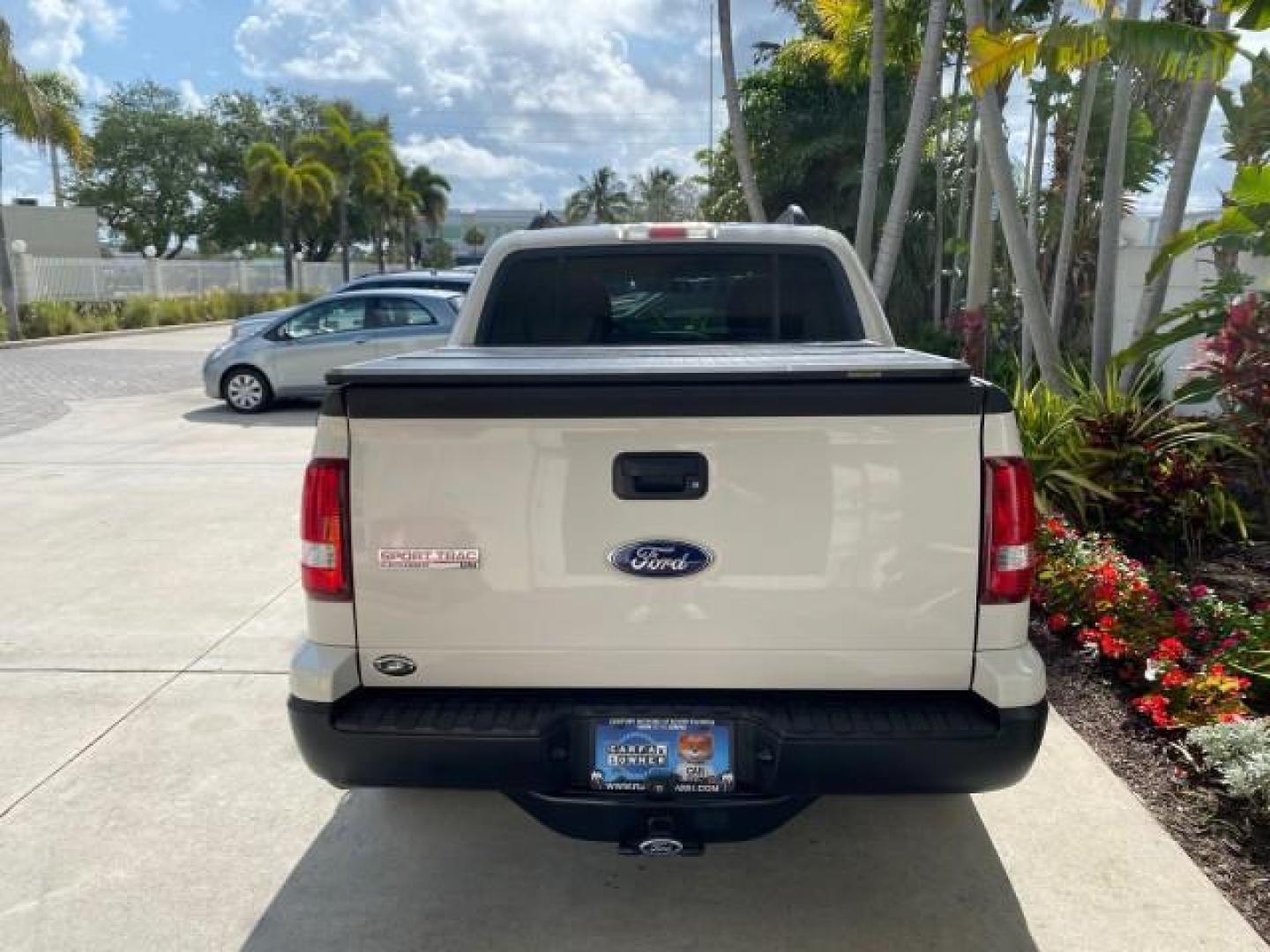2009 White Suede /Camel Ford Explorer Sport Trac XLT LOW MILES 73,848 (1FMEU31E99U) with an 4.0L SOHC 12-Valve V6 Engine engine, Automatic transmission, located at 4701 North Dixie Hwy, Pompano Beach, FL, 33064, (954) 422-2889, 26.240938, -80.123474 - OUR WEBPAGE FLORIDACARS1.COM HAS OVER 100 PHOTOS AND FREE CARFAX LINK 2009 Ford Explorer Sport Trac XLT Sport Pickup 4.0L V6 F SOHC 12V Gasoline 21 MPG Rear Wheel Drive Features ABS Brakes Air Conditioning Alloy Wheels AM/FM Stereo Automatic Transmission Auxiliary Audio Input CD Audio Cloth Seats Cr - Photo#96