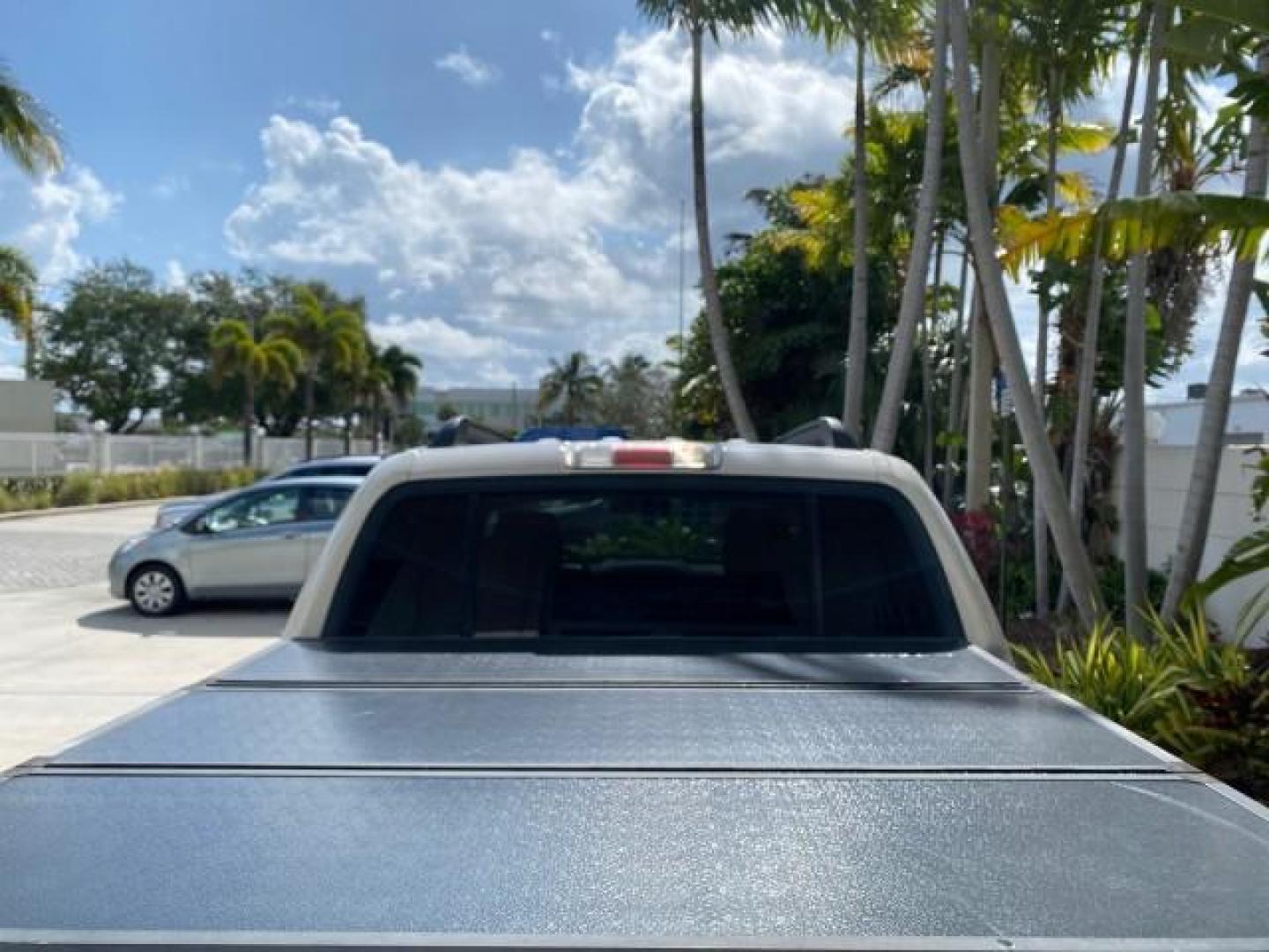 2009 White Suede /Camel Ford Explorer Sport Trac XLT LOW MILES 73,848 (1FMEU31E99U) with an 4.0L SOHC 12-Valve V6 Engine engine, Automatic transmission, located at 4701 North Dixie Hwy, Pompano Beach, FL, 33064, (954) 422-2889, 26.240938, -80.123474 - OUR WEBPAGE FLORIDACARS1.COM HAS OVER 100 PHOTOS AND FREE CARFAX LINK 2009 Ford Explorer Sport Trac XLT Sport Pickup 4.0L V6 F SOHC 12V Gasoline 21 MPG Rear Wheel Drive Features ABS Brakes Air Conditioning Alloy Wheels AM/FM Stereo Automatic Transmission Auxiliary Audio Input CD Audio Cloth Seats Cr - Photo#97